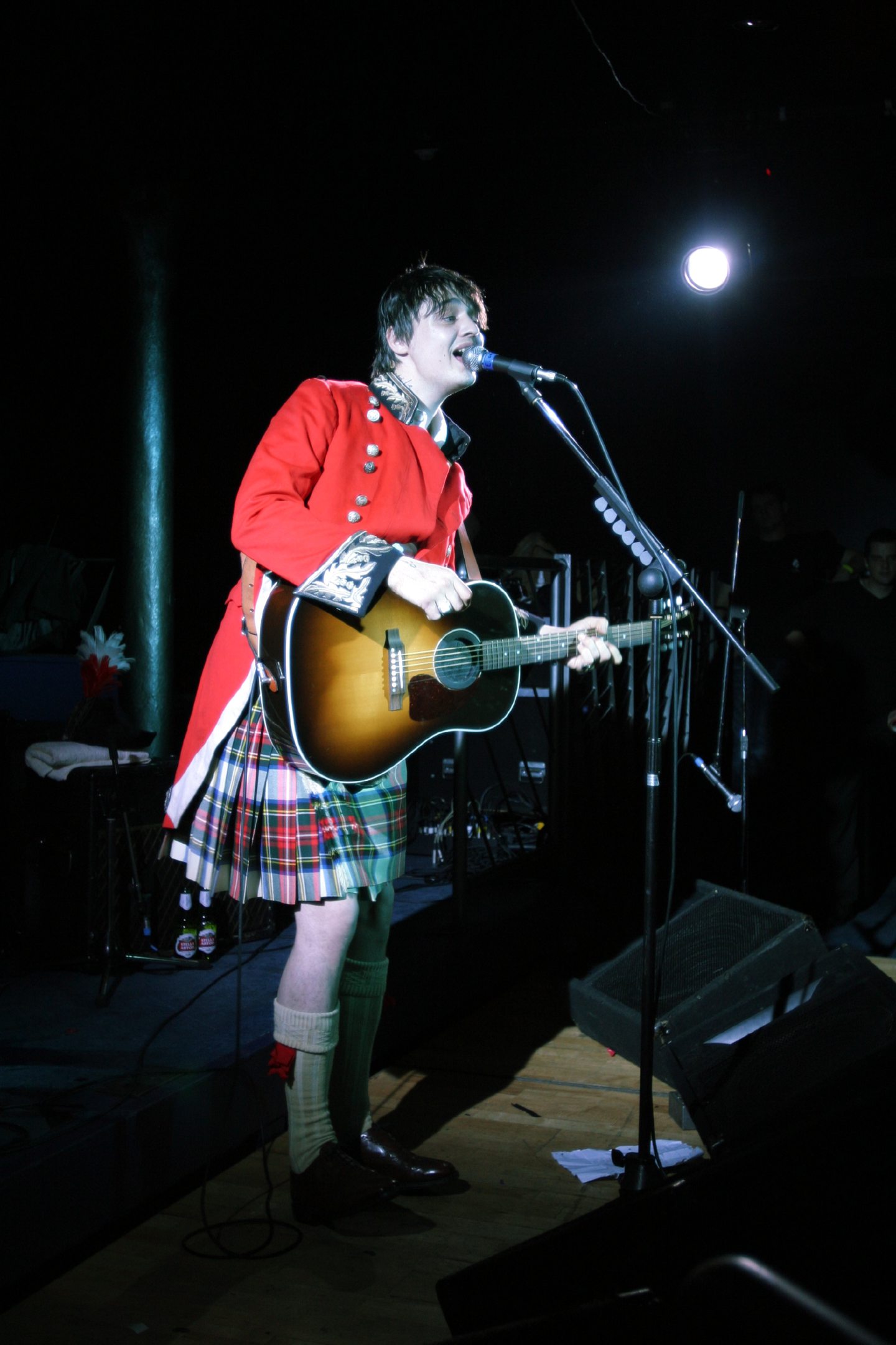 Pete Doherty on stage in a military jacket and kilt at Fat Sam's in 2009. Image: DC Thomson.