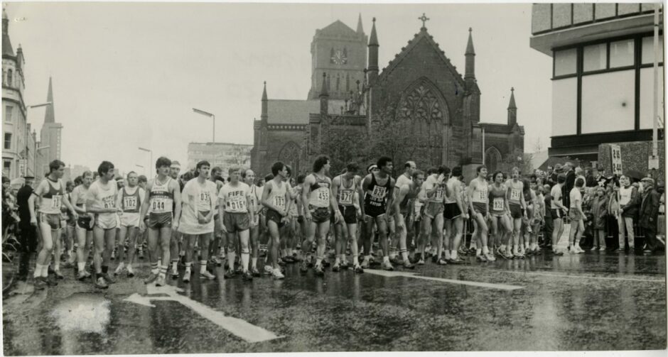 Runners get ready to go at the start of the Marathon outside the Overgate