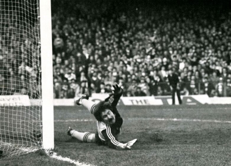 Hamish McAlpine is beaten by a penalty from Charlie Nicholas at Celtic Park. Image: DC Thomson.