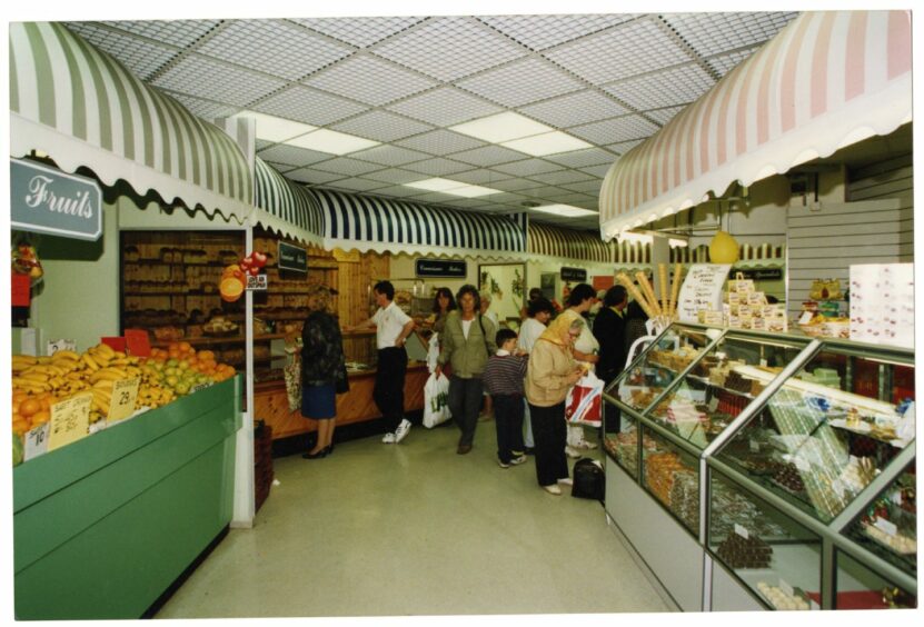 Fresh fruit and sweet counters in the indoor market in 1993. Image: DC Thomson.
