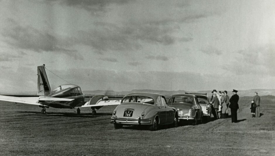 A light aircraft sits on the landing strip following the first flight at Riverside Drive in 1962. Image: DC Thomson.
