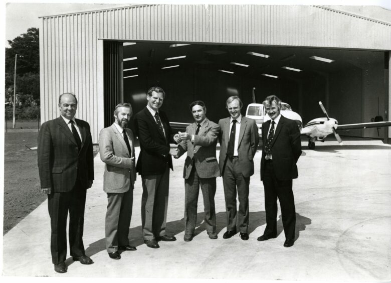 Lovat Fraser receives the keys for a new multi-purpose hangar at Dundee Airport in 1982. Image: DC Thomson.