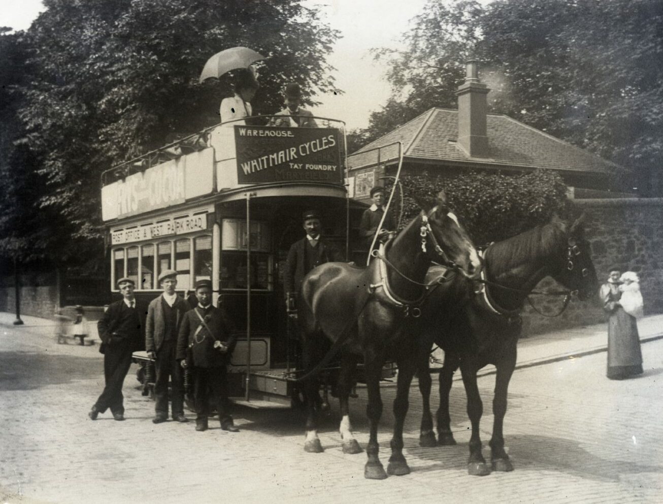 A horse-drawn tram carrying passengers in Dundee.