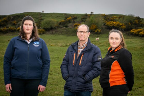 Pictured from left is Grace Reid, Jim Fairlie MSP and Hannah McKerrow from Three Bridges Vets.