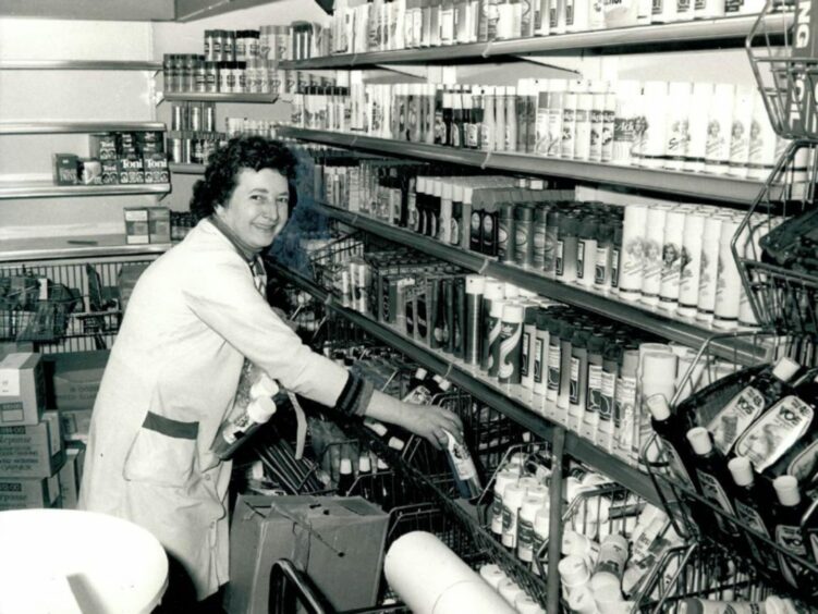 Annie Docherty at work stocking shelves in Pennywise in 1979. Image: DC Thomson.