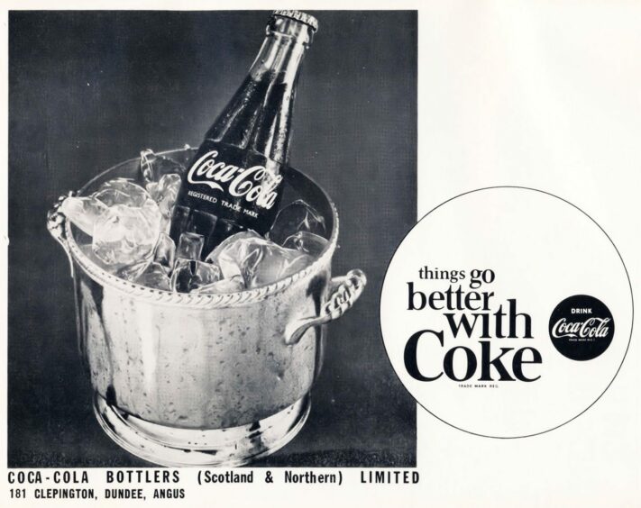 An old, black and white Coke advert, with a bottle of Coke in an ice bucket.