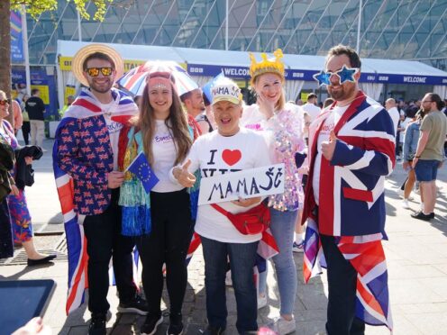 Fans arrive to watch the grand final of the Eurovision Song Contest at the M&S Bank Arena in Liverpool (Peter Byrne/PA)