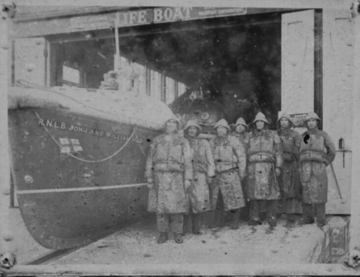 Crew members with the John and William Mudie lifeboat, which entered service in 1932. Image: Paul Reid.