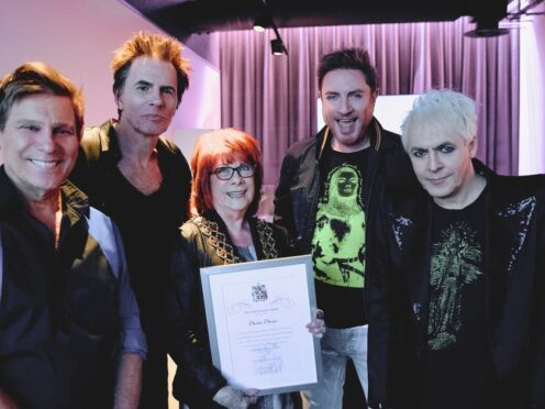 Duran Duran with the Lord Mayor of Birmingham, upon receiving their civic honour from Birmingham City Council. (Birmingham City Council/PA)