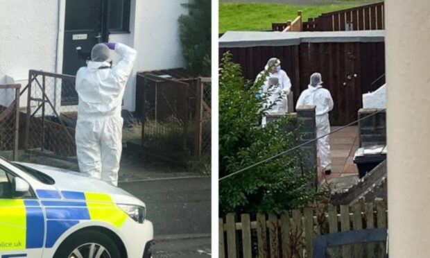 Police and forensics experts at Rhys Bennett's home in Fife.