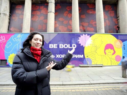 Ukrainian artist Mariana Potetenko, who came to Liverpool from Kyiv, with her Eurovision design which has gone on display in Bold Street (Liverpool City Region Combined Authority/PA)