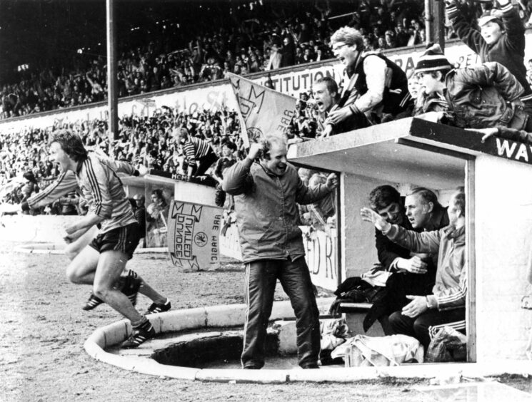 Paul Sturrock races out of the dugout following the final whistle at Dens Park. Image: DC Thomson.