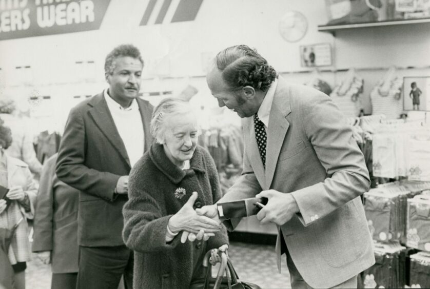 Henry Cooper handing out Brut gift packs during his visit to BHS in 1978. Image: DC Thomson.
