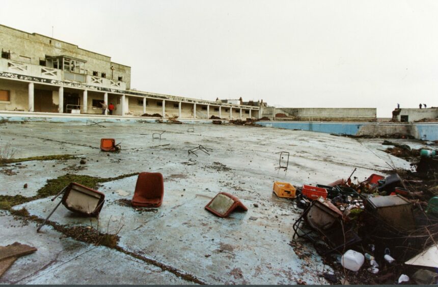 The dilapidated former swimming pool littered with rubbish. Image: DC Thomson.