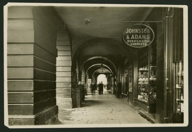 A view of The Pillars, Old Town House, Dundee, showing the dispensing chemist in 1932. Image: DC Thomson.