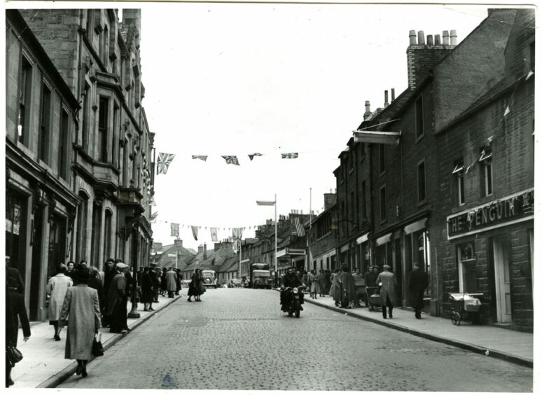 Forfar East High Street was decked out in red, white and blue for the coronation of the Queen. Image: DC Thomson.