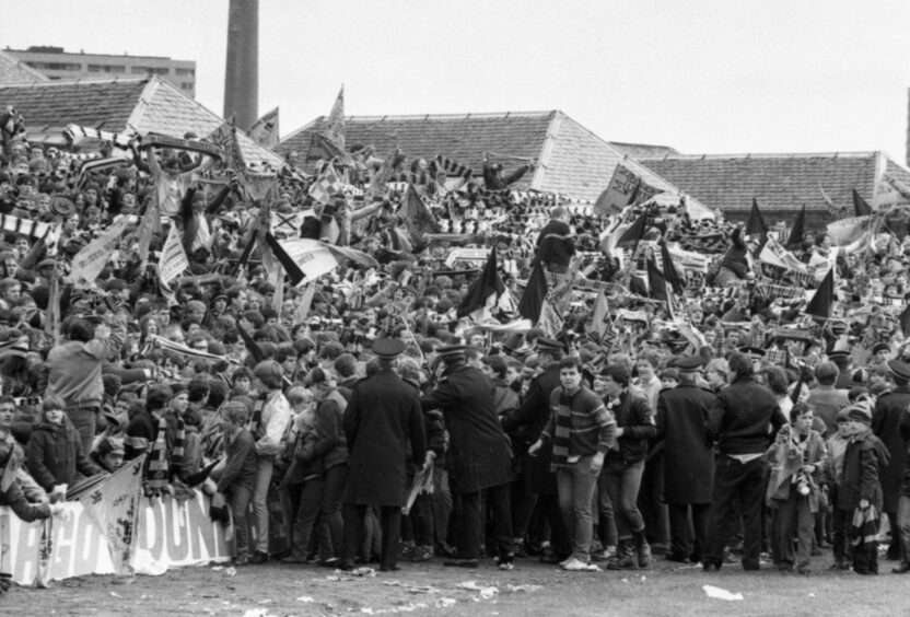 Dundee United supporters start to spill on to the field at the final whistle. Image: DC Thomson.
