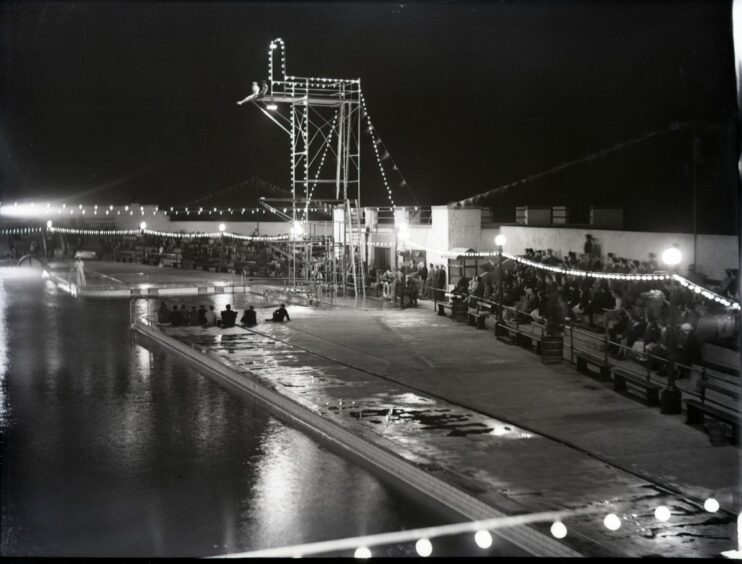 The Arbroath outdoor pool is shown illuminated at night during its glory days. Image: DC Thomson.