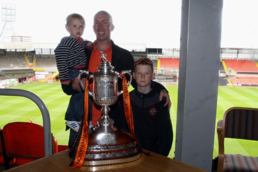 The Cusick family were among those who posed with the Scottish Cup in 2010. Image: DC Thomson.