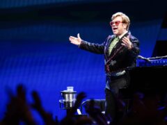 Sir Elton John will headline at Glastonbury (Ian West/PA)