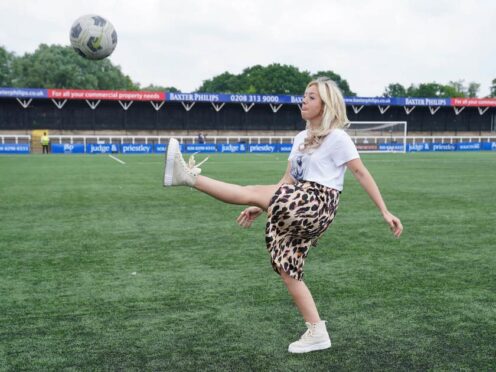 Tom Parker’s widow Kelsey Parker kicks a ball (Lucy North/PA)