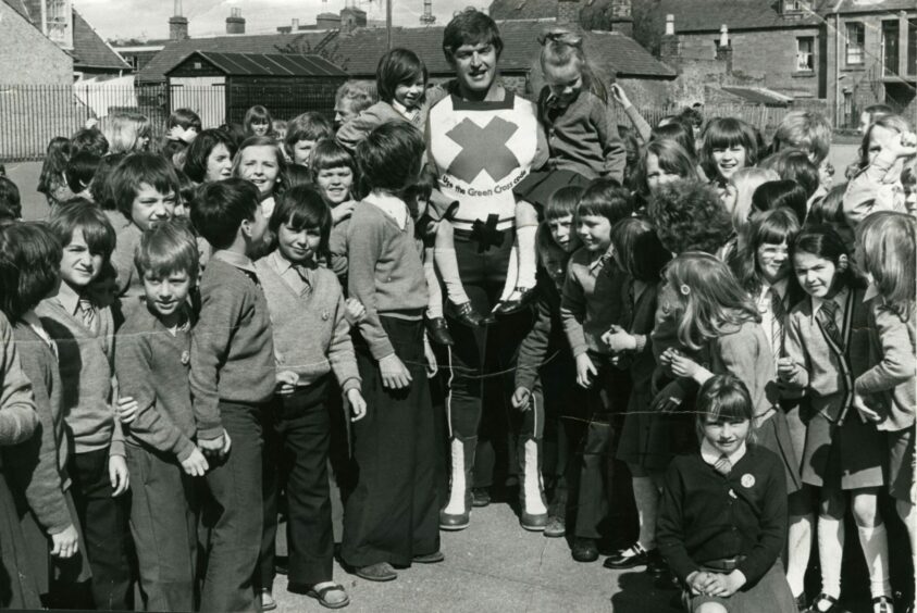 David Prowse at Ancrum Road School in 1977 in his guise as the Green Cross Code Man. Image: DC Thomson.
