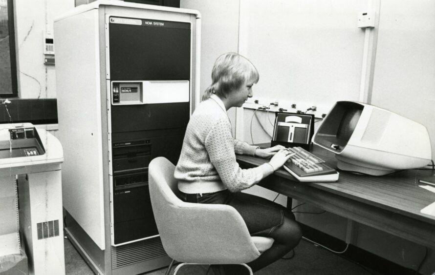 Janet Rae operating a computer at Gate Microsystems Ltd in December 1981. Image: DC Thomson.