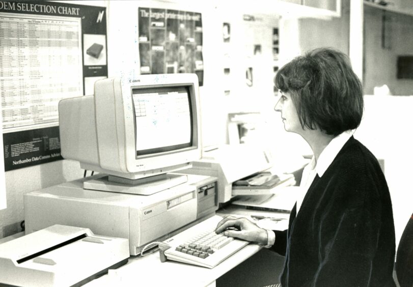 Norma Paterson at a keyboard in the Dundee office. Image: DC Thomson.