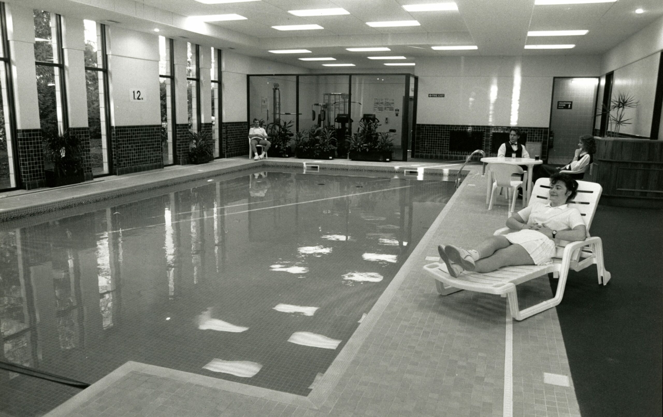 Staff sit by the pool in the The Woodlands Hotel in January 1990.
