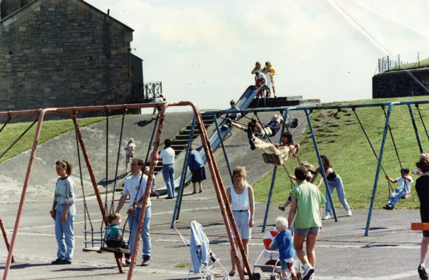 Having fun on the swings at Castle Green. Image: DC Thomson.