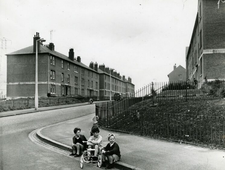 Kids on the kerb outside Mid Craigie houses. Image: DC Thomson.
