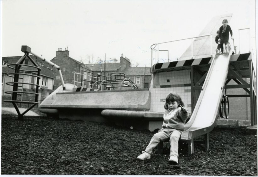 A group of children enjoying the chute at the Black Street play park in April 1987. Image: DC Thomson.