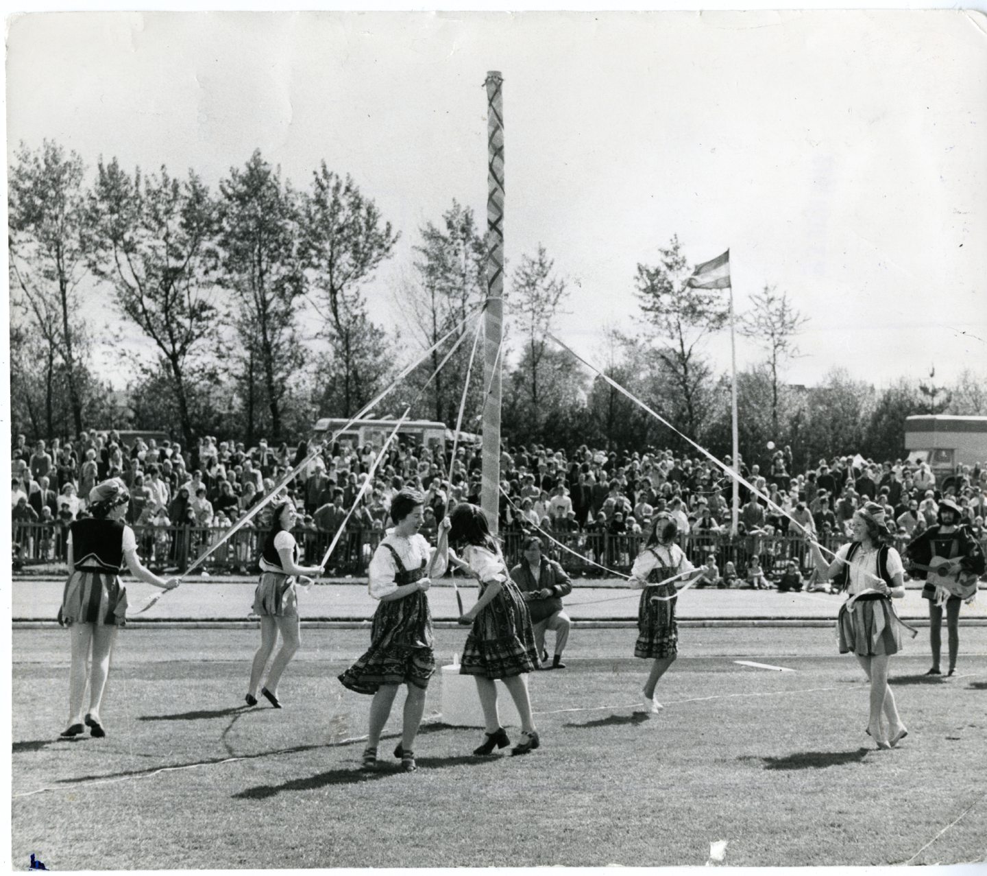 Young girls dancing around the maypole at Caird Park in Dundee