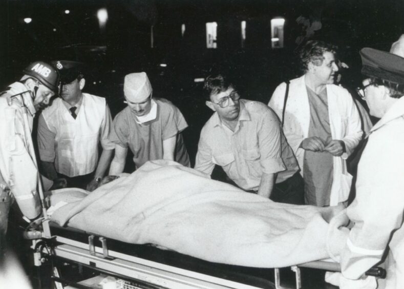 Medical staff and volunteers transport a casualty to Aberdeen Royal Infirmary. Image: DC Thomson.