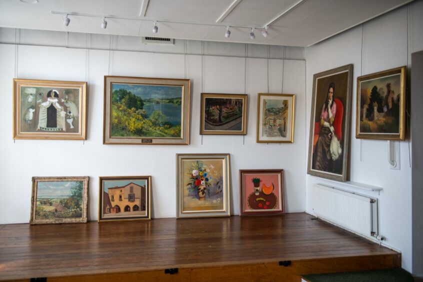 A selection of paintings in the exhibition from all four of the artists.