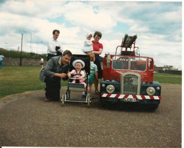 Do you remember the legendary fire engine? The McFarlane family enjoy a day out in 1986. Image: Supplied.