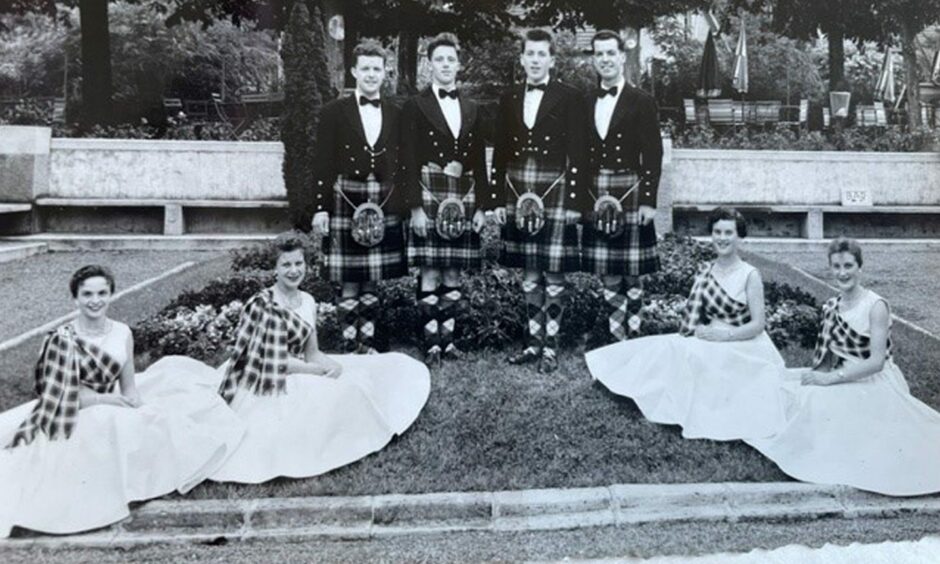 June Thomson seated second from right with the Gie Gordons dancers.