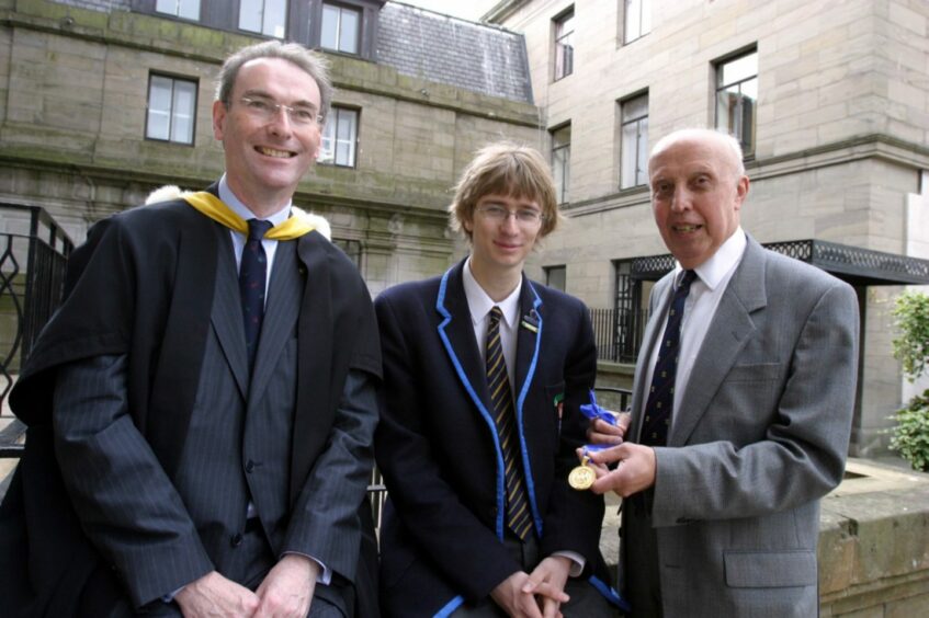 Dundee High School rector Mike Duncan with school dux Steven King and Dr John Blair when he was presented with his 1946 dux medal.