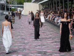 Models wear creations for the Chanel Haute Couture Fall/Winter 2023-2024 fashion collection presented in Paris (Christophe Ena/AP)