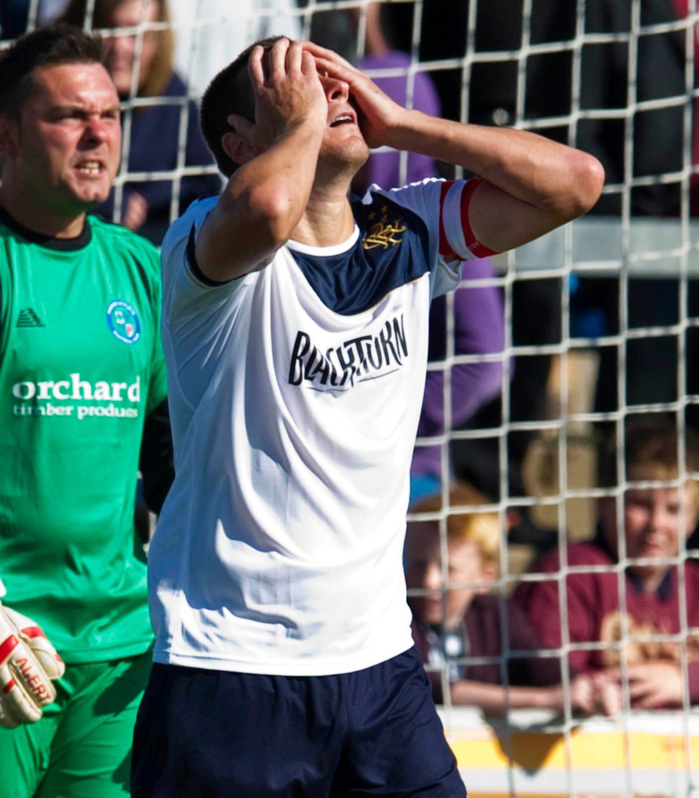 Lee McCulloch has his head in his hands after his mistake for the opening goal. Image: SNS.