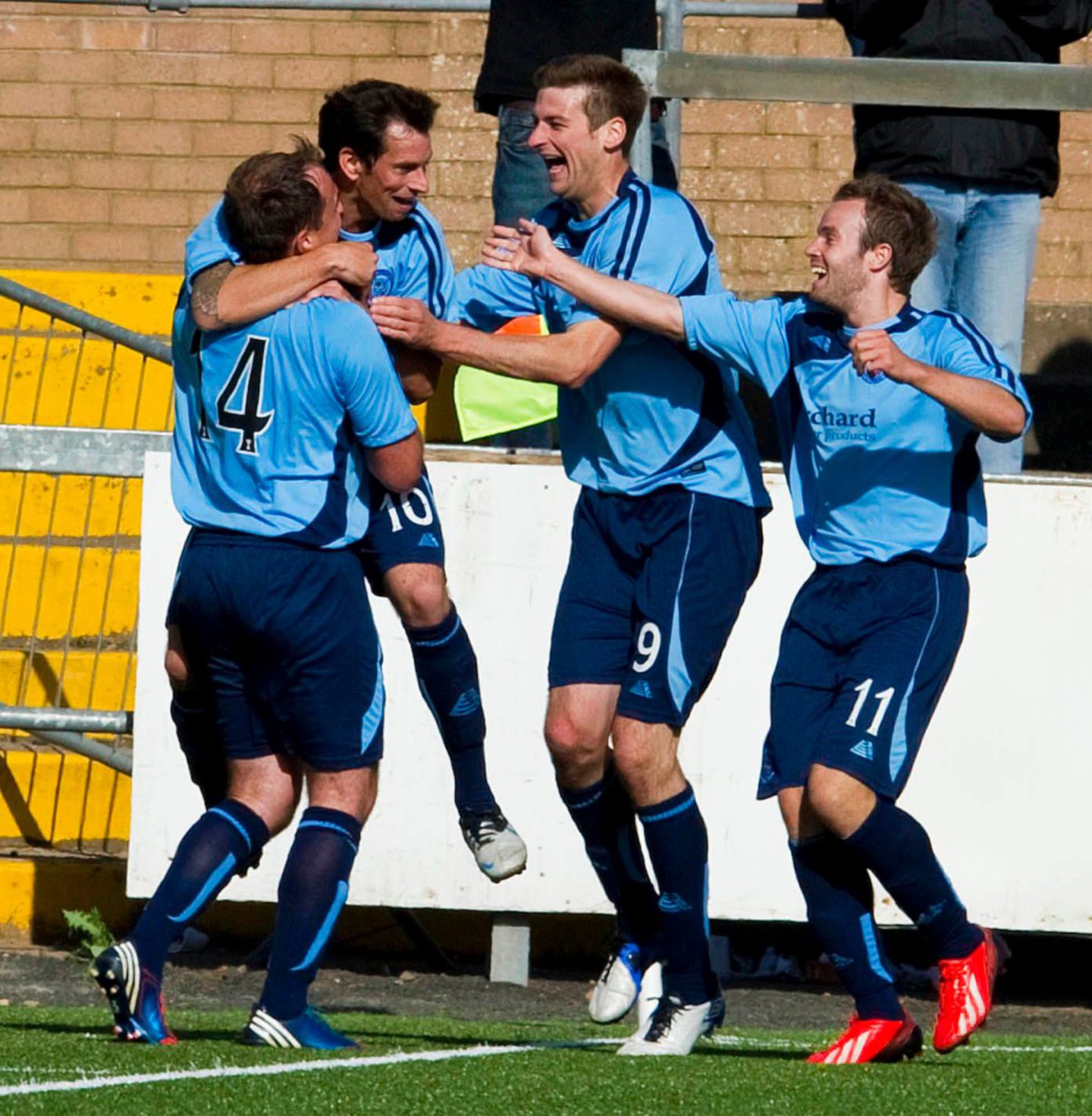 Swankie is mobbed by his team mates after scoring deep in extra-time to give Forfar the lead. Image: SNS.