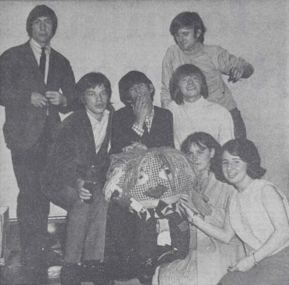 Jean Gracie and Ann Brown with the gonk as they joined the Stones backstage in Dundee. Image: DC Thomson.