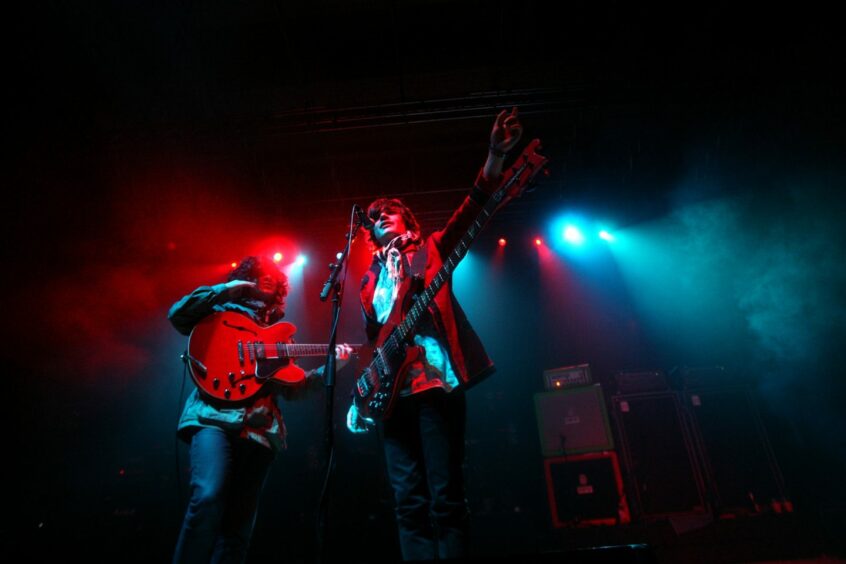 Kyle Falconer and bassist Kieran Webster on stage at the Christmas concert in 2009.