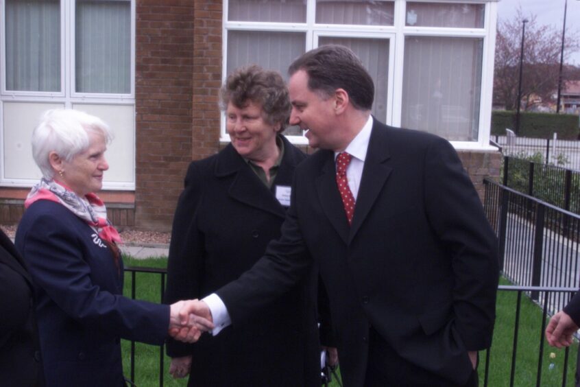 Bette Gurvan, centre, introduces First Minister Jack McConnell to Ardler resident Ina Anderson during a visit in 2002.