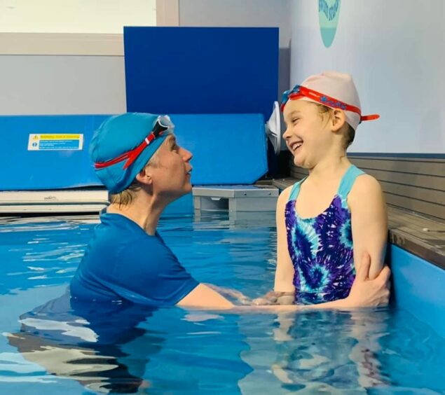 Mrs Donoghue, of Blue Sky Swim Studio, with a promising young swimmer, Selah, from Balmedie.