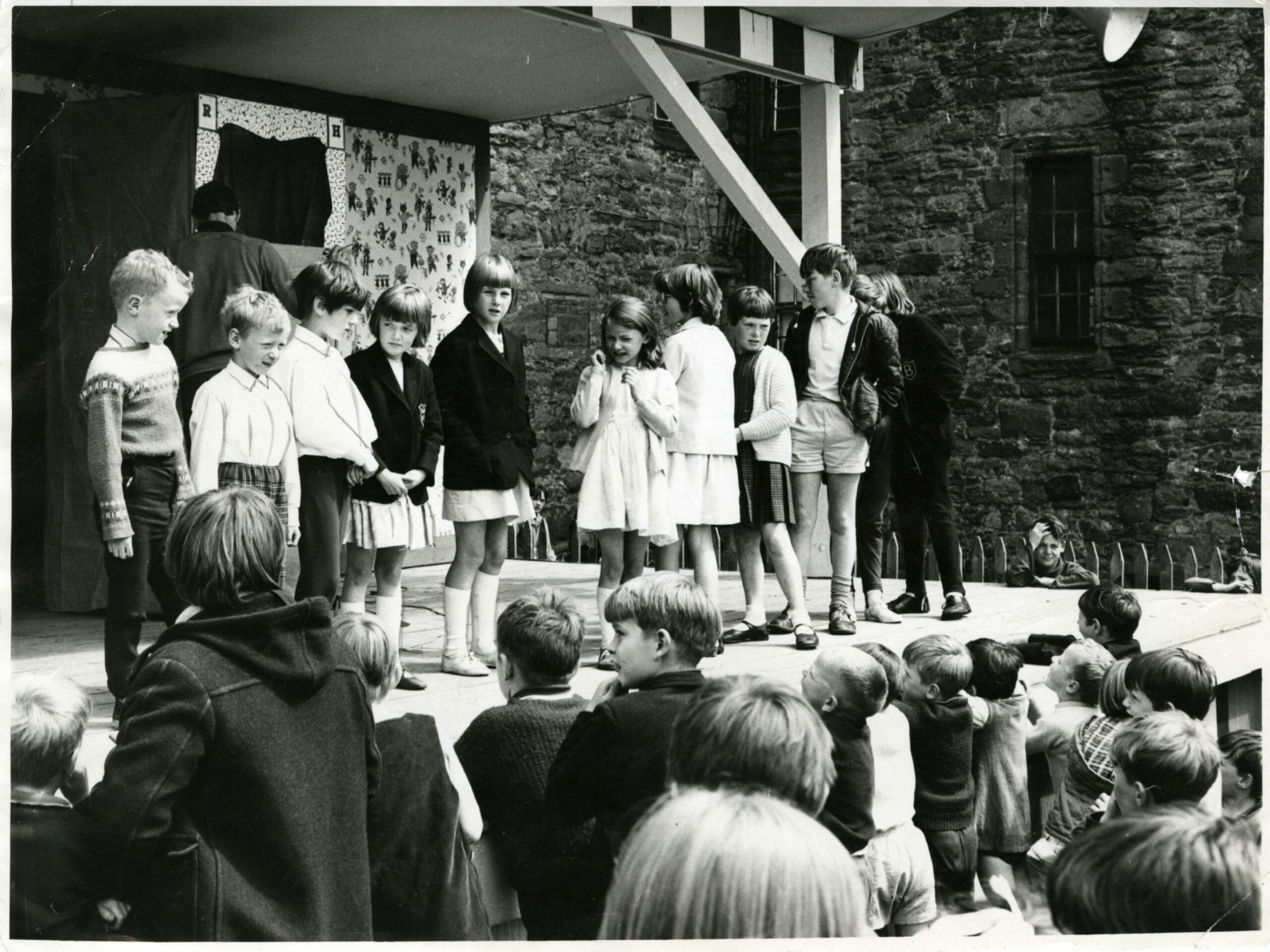 Youngsters waiting for the verdict on a stage after a summer talent show was held in 1968