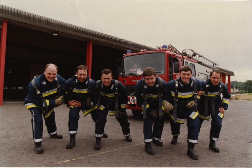 Macalpine Fire Station senior officers taking part in a charity engine pull. Image: DC Thomson.