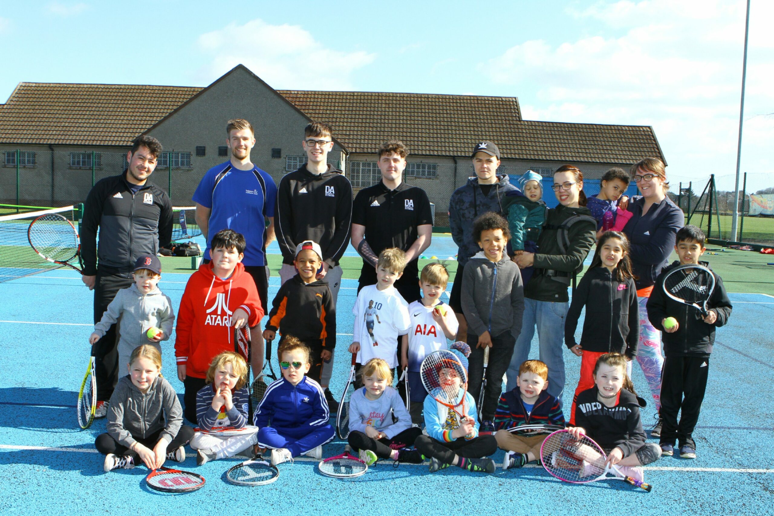 Children and staff at a tennis weekend