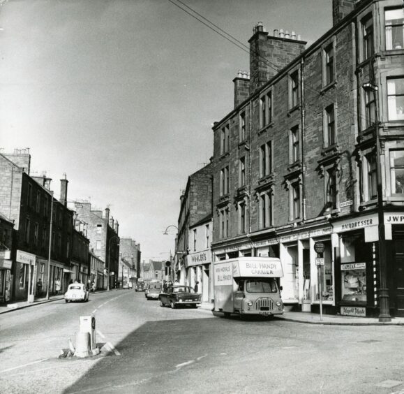 This image shows several shops including a hairdresser on the corner. Image: DC Thomson.