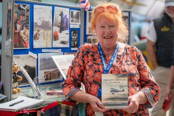 Author, Margaret Bowman with her latest book - The Lost Airfields of Angus.